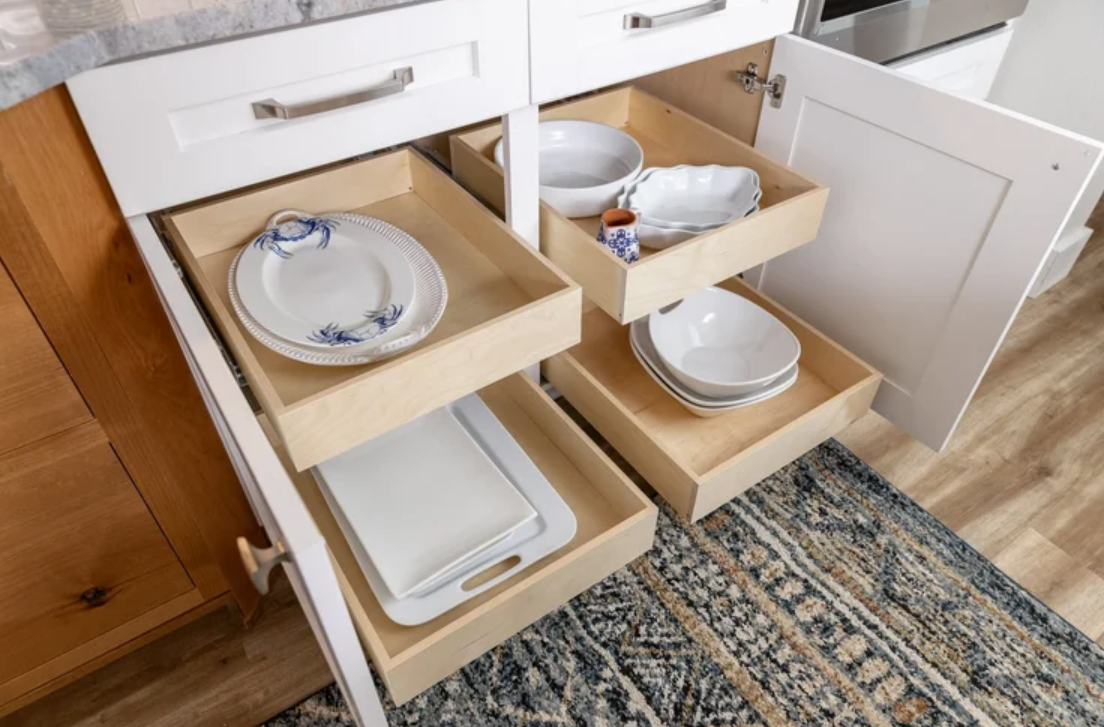 ckd-remodeling-cantonment-fl-kitchen-must-have-features-pull-out-drawers-inside-base-cabinets-for-easy-storage-platters-and-bowls-timeless-design-build.png