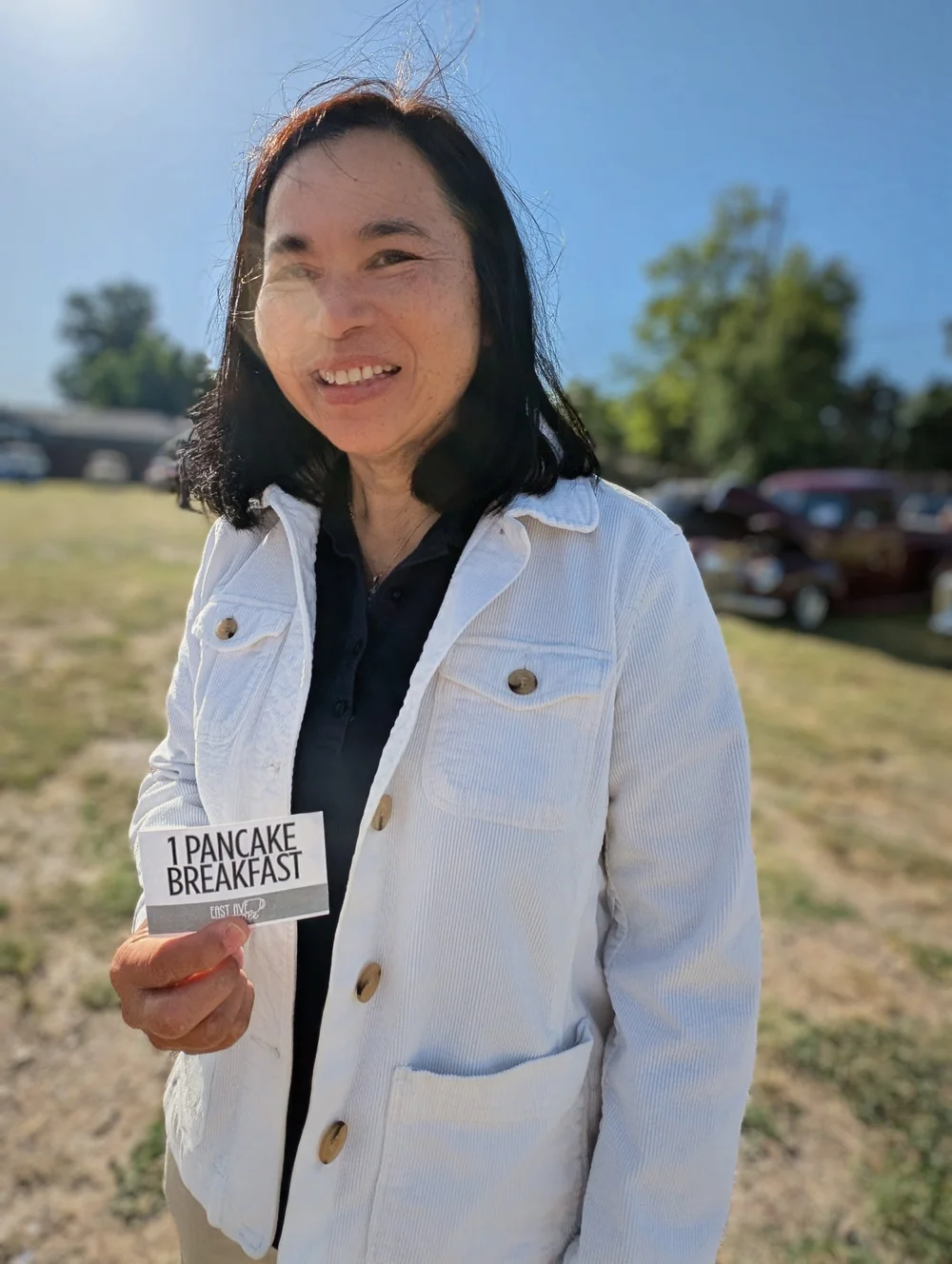 Salina holding a 1 Pancake Breakfast raffle ticket