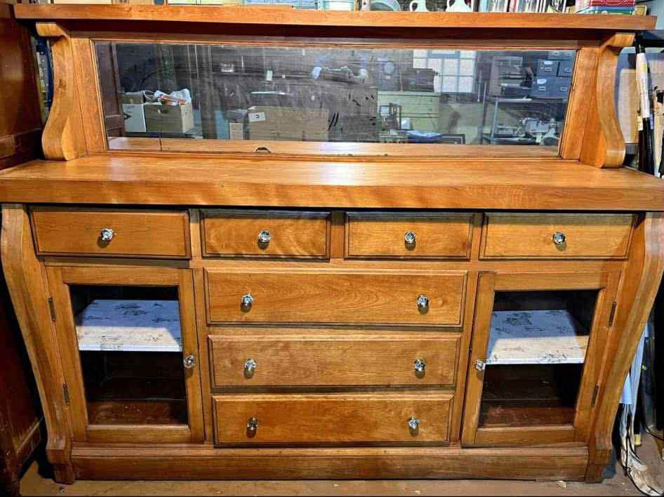 The original buffet had several gouges and chunks taken out of the wood, along with rotted drawer bottoms. I completely sanded every inch of this piece, repaired and re-glued the broke or damaged areas then stained it a lovely chestnut finish with a 