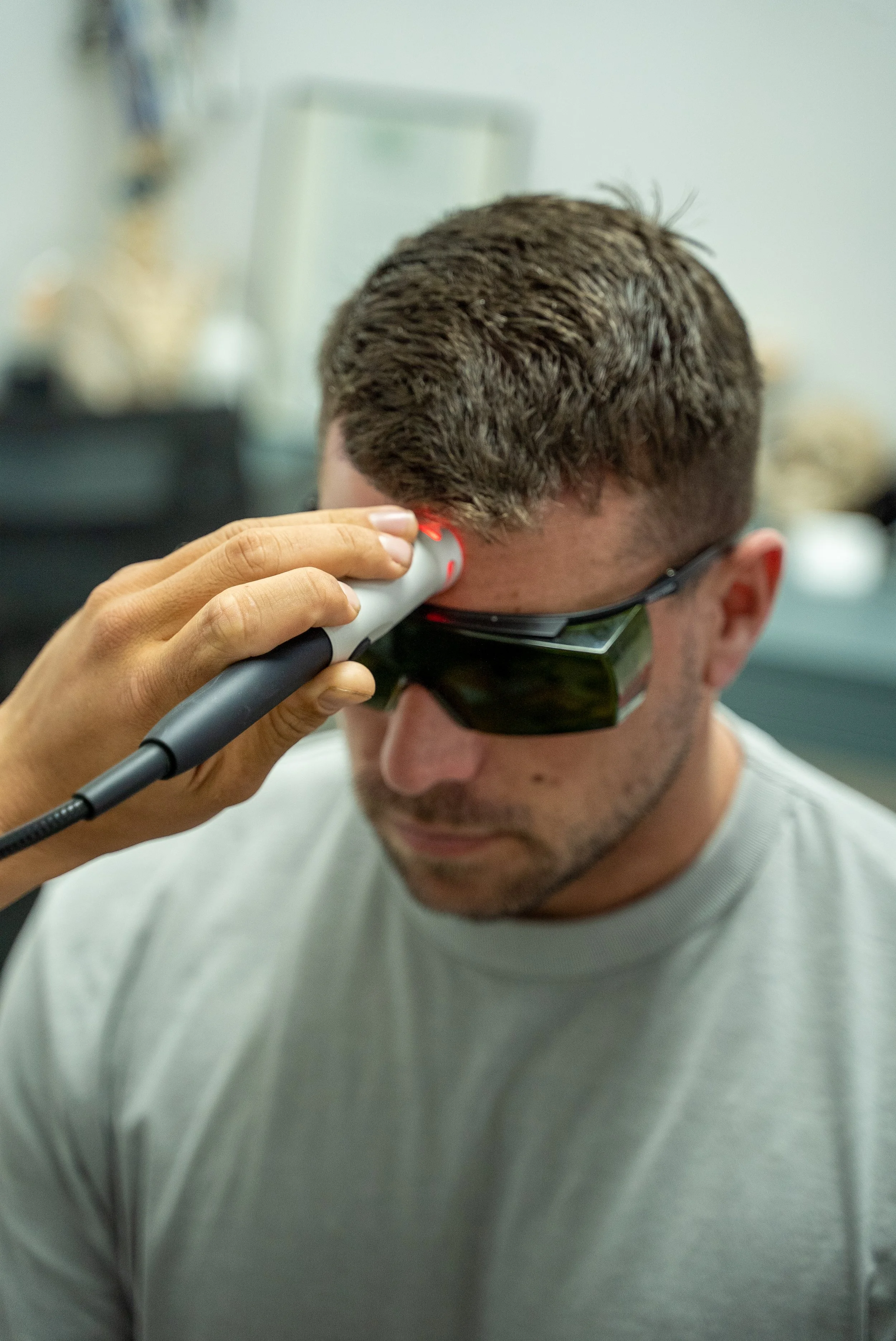 Photobiomodulation Therapy session using advanced laser technology to promote tissue healing and reduce inflammation.