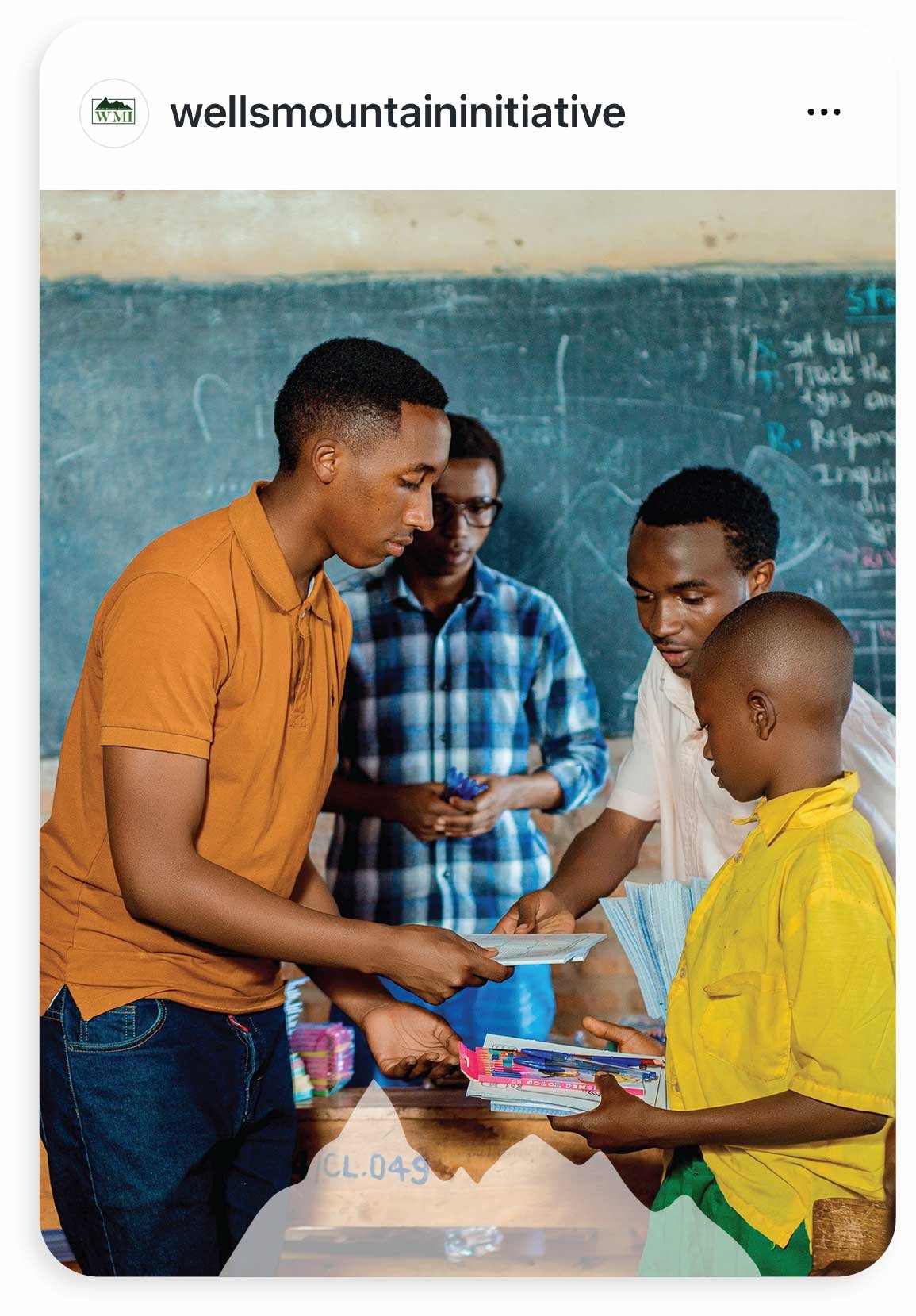 Wells Mountain Initiative male teacher  with three students or Instagram