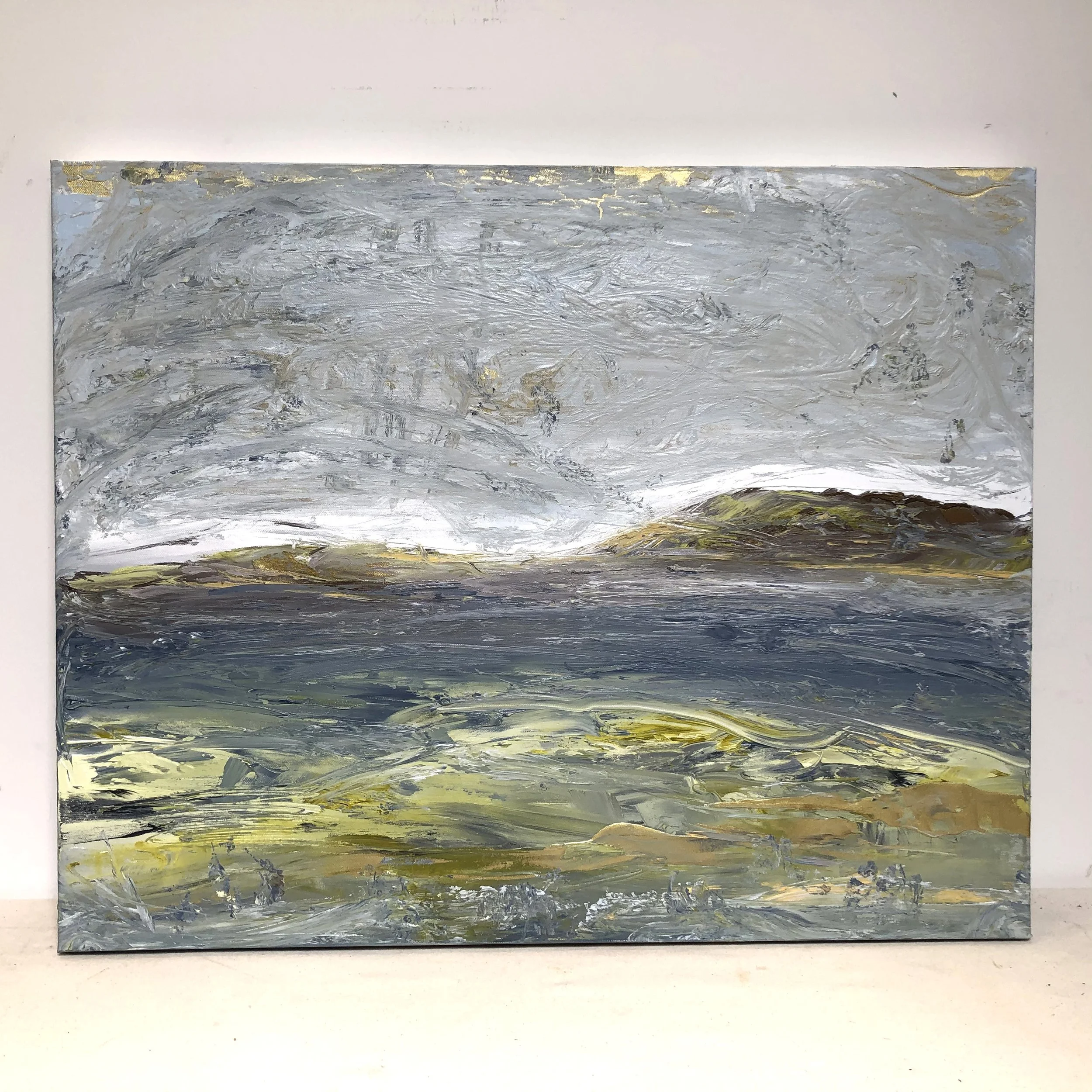 Abstract landscape painting of a cloudy sky over a body of water with hills in the background, using thick brushstrokes in gray, green, and yellow tones.
