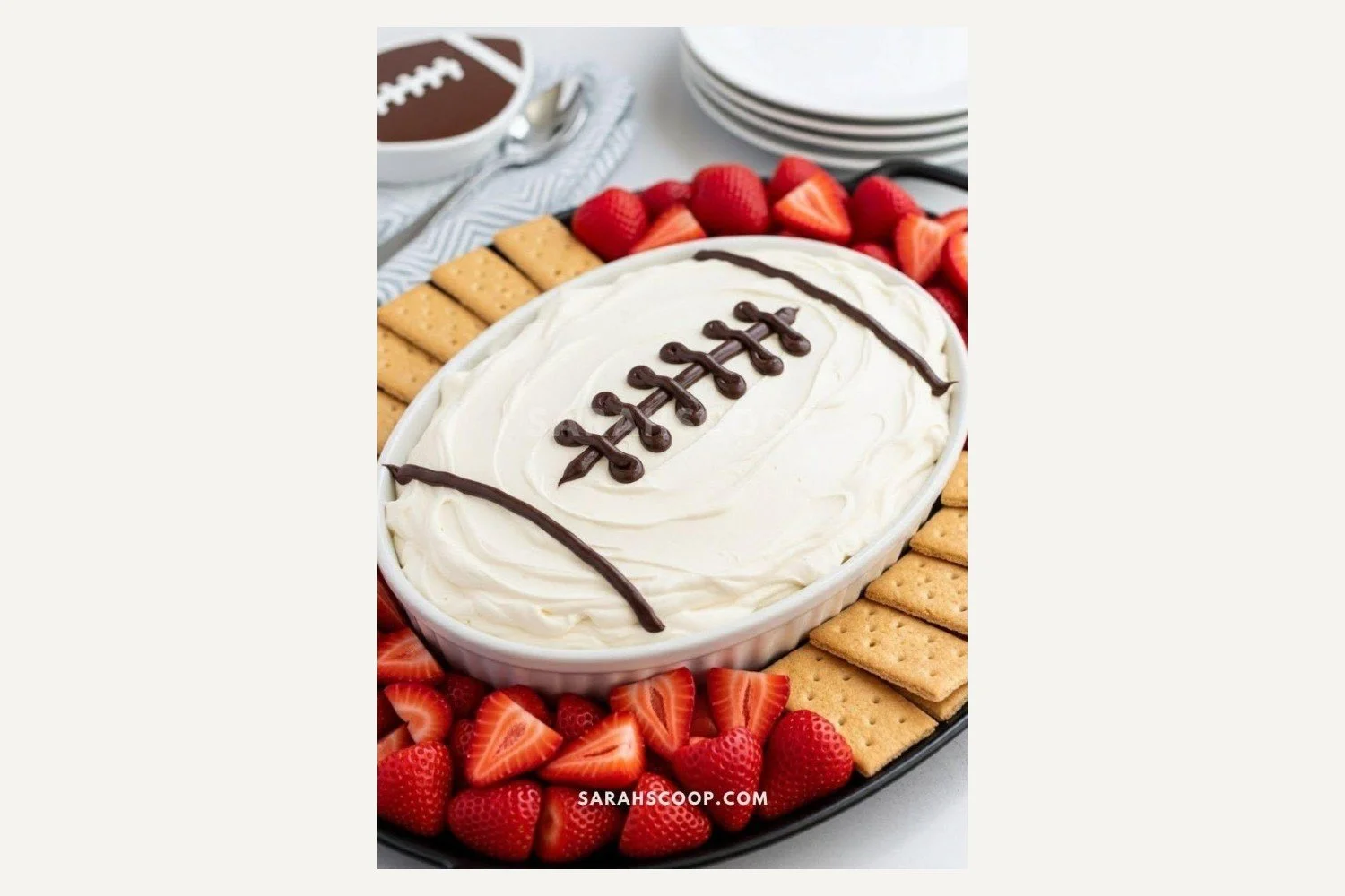 Football-shaped marshmallow dessert dip with chocolate laces