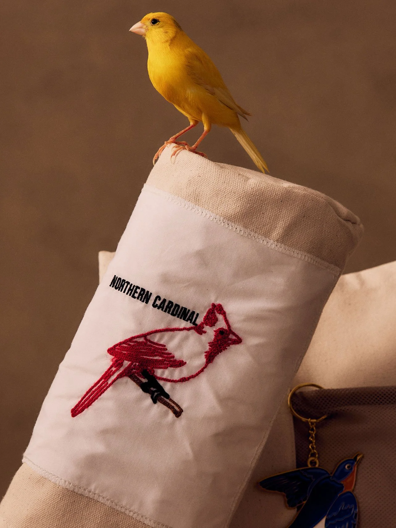Malbon x GGNC Northern Cardinal embroidered driver headcover with a canary perched on top