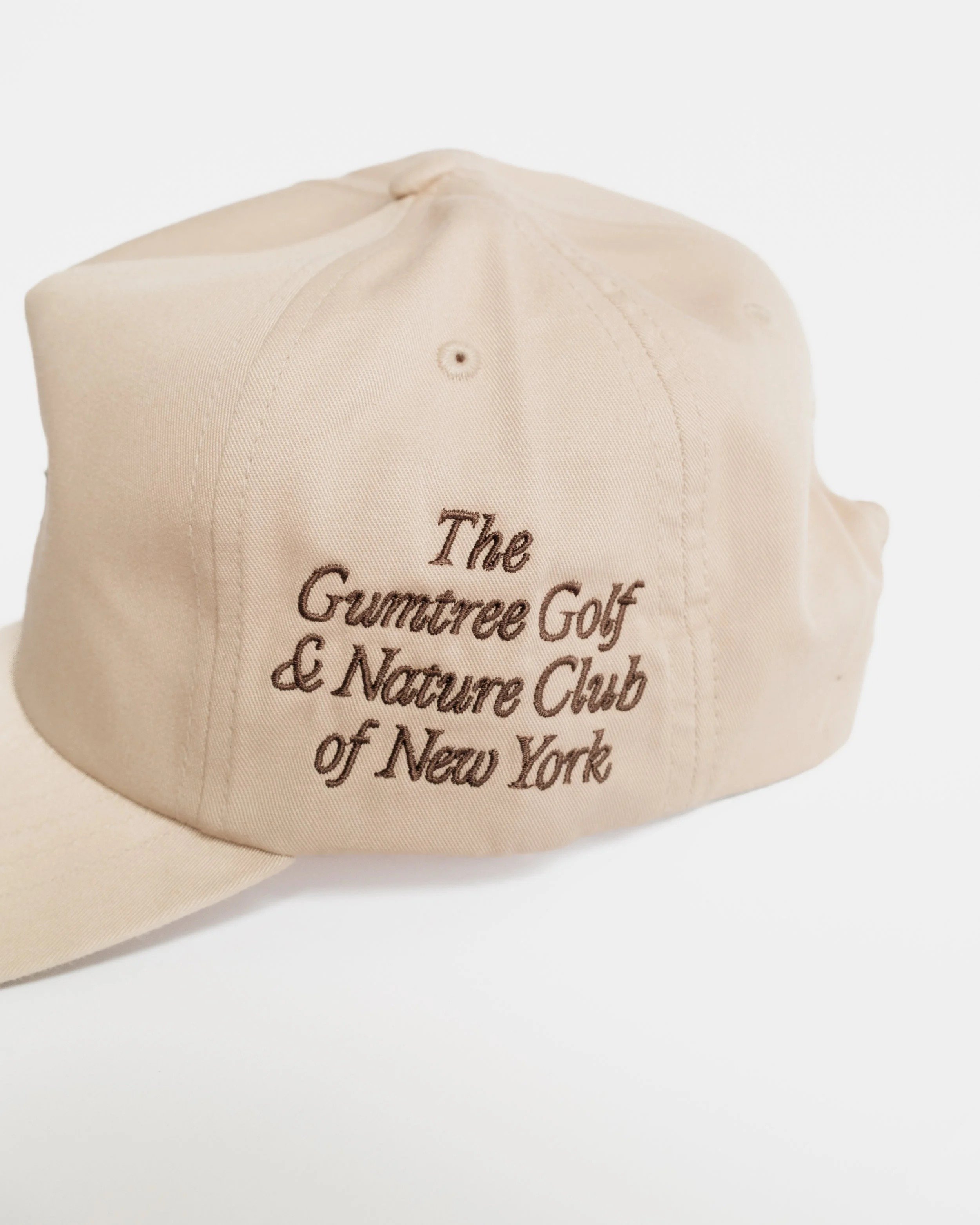 Khaki New York Branches unstructured 5-panel golf hat, side view with Gumtree Golf & Nature Club of New York script embroidery