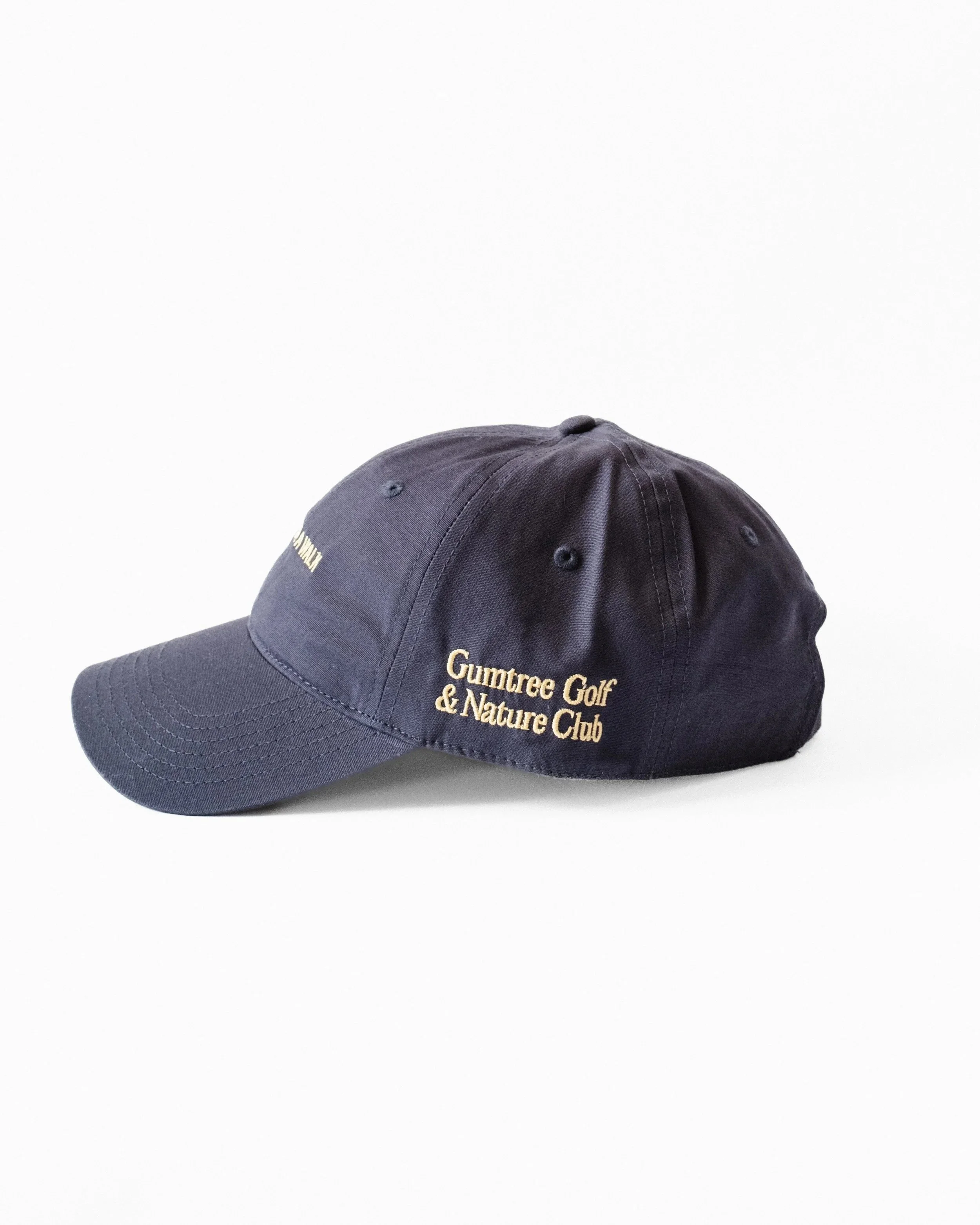 Navy and gold Just Out For A Walk dad hat, side view