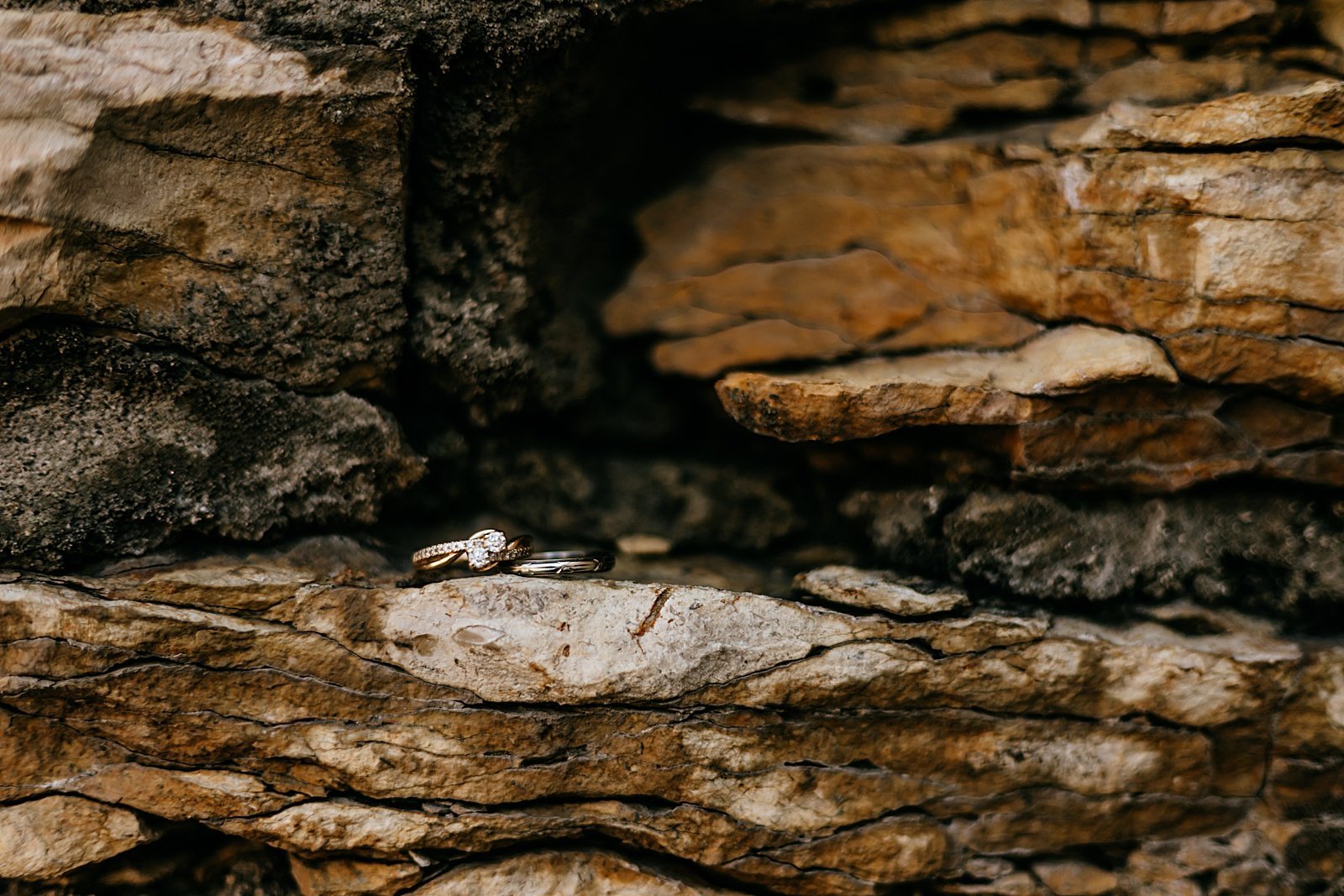  Wedding rings on a stone ledge at Mayowood Stone Barn in Minnesota 