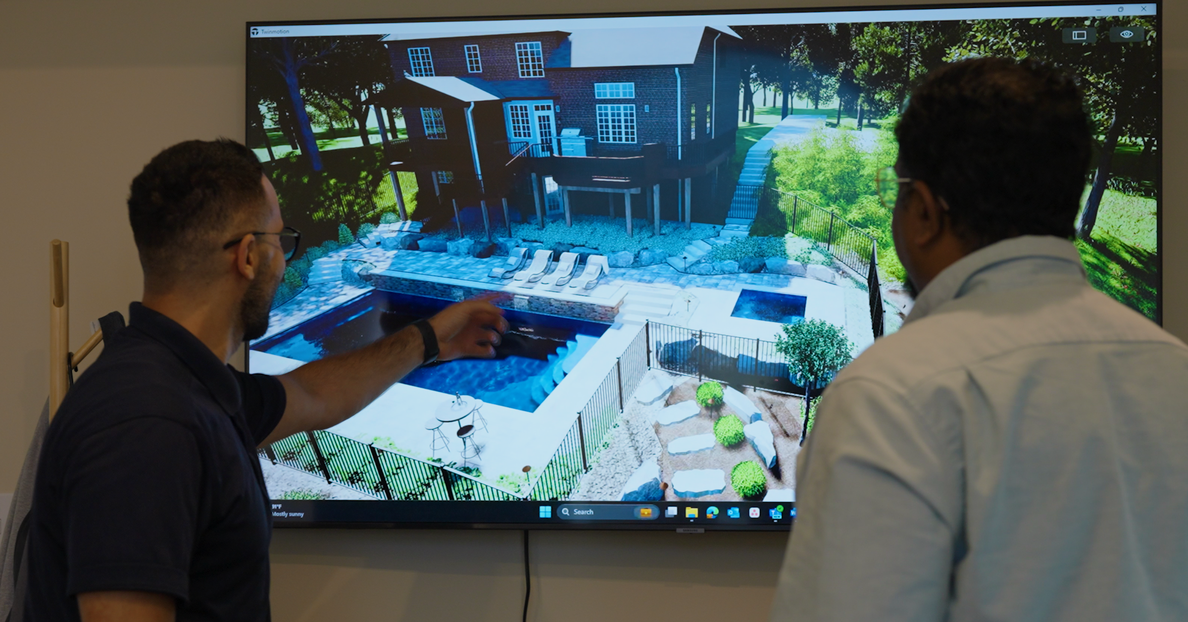 Vizyon reviewing 3D architectural render for Pittsburgh luxury backyard