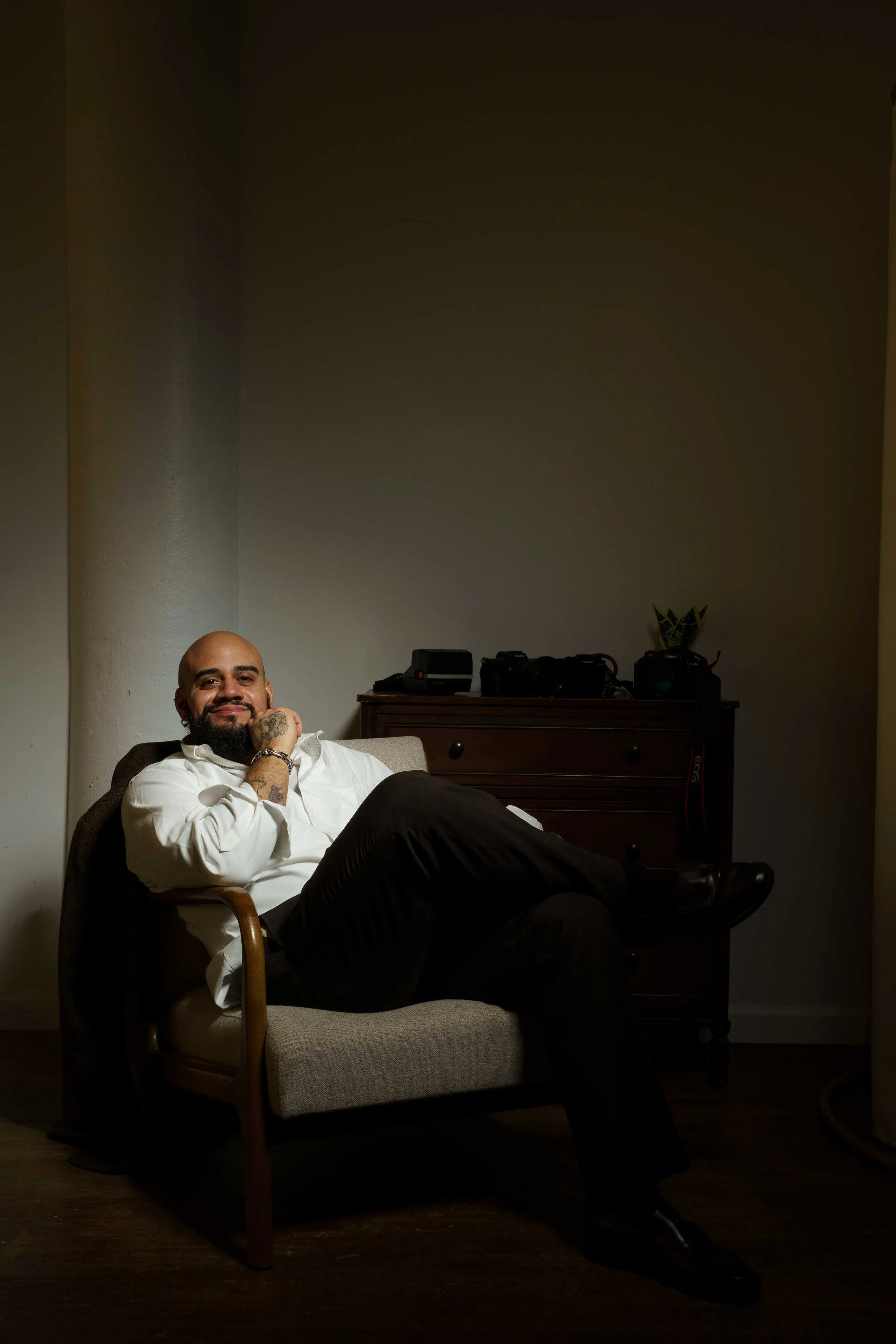 new jersey wedding photographer smiling at the camera while sitting down