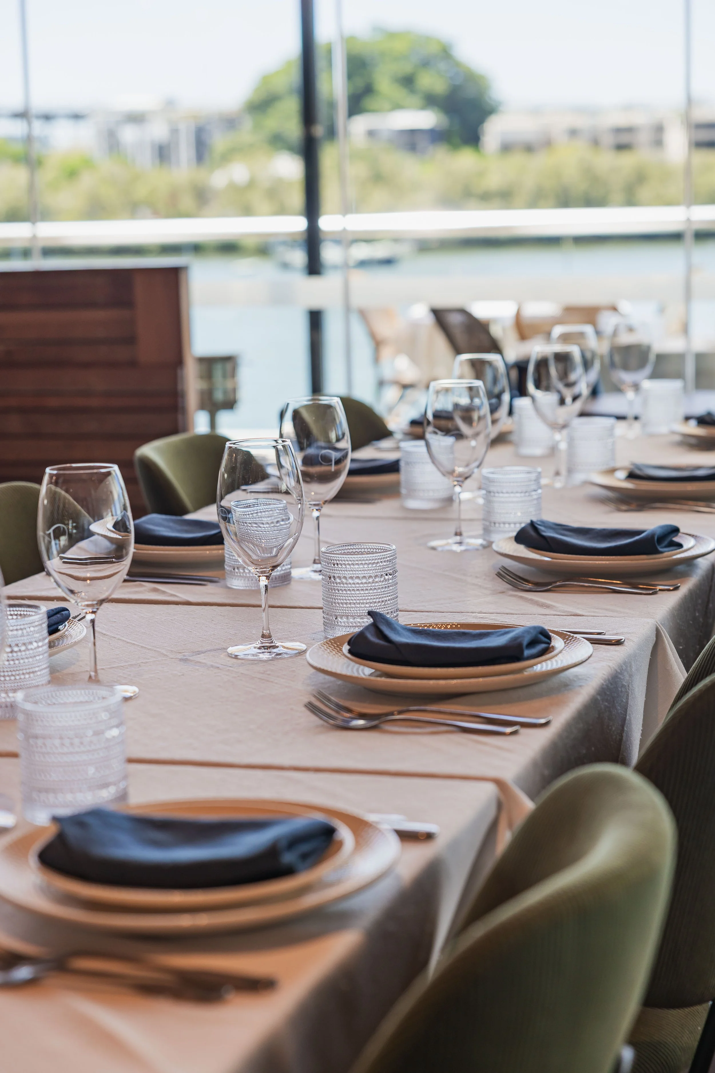 Group dining at Tillerman Brisbane — riverside table setting for 10 or more guests