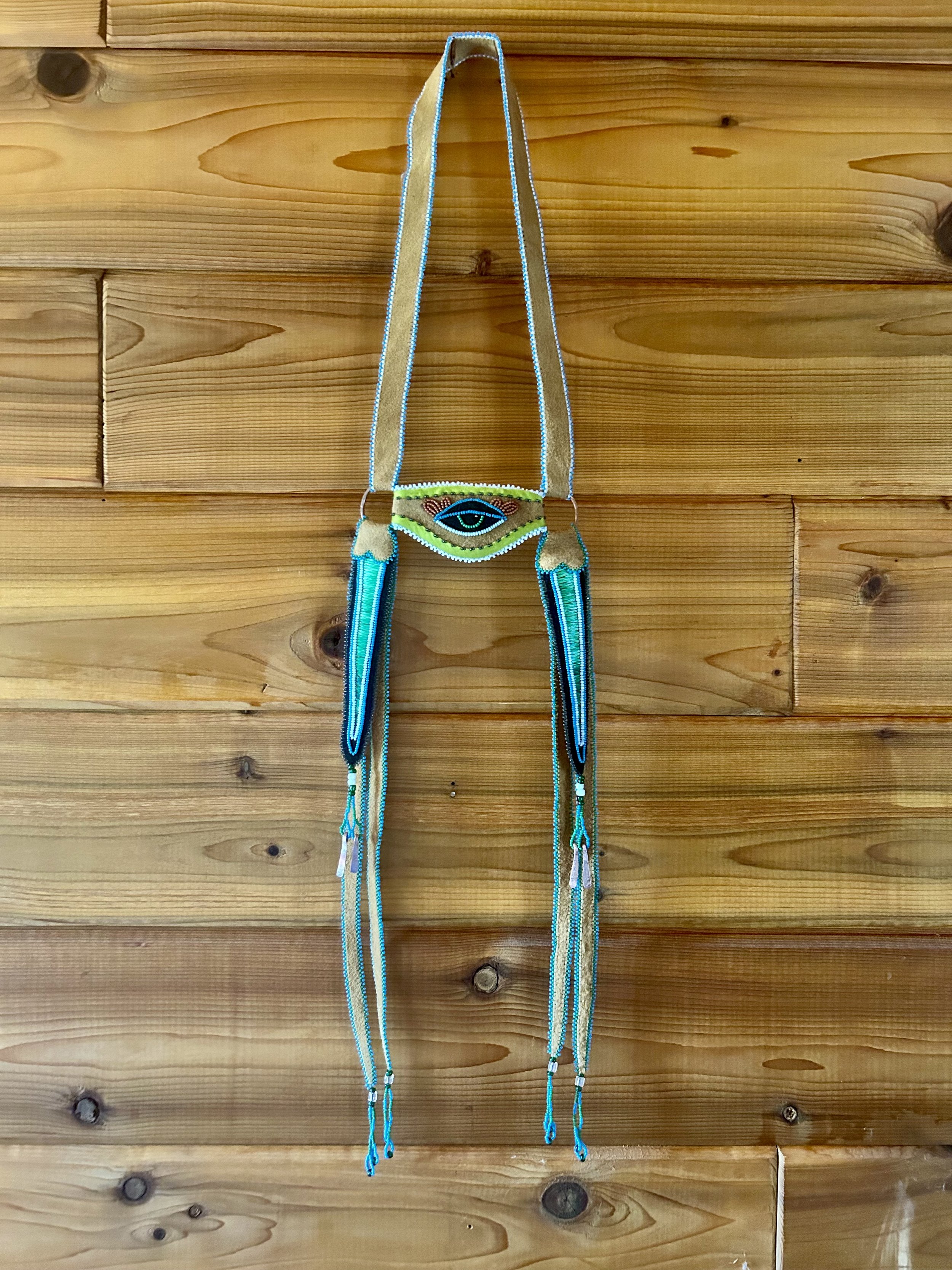 Headstall - 2024 - moosehide, glass beads, porcupine quills, wool, recycled copper, cedar, sage, sweetgrass & tobacco.