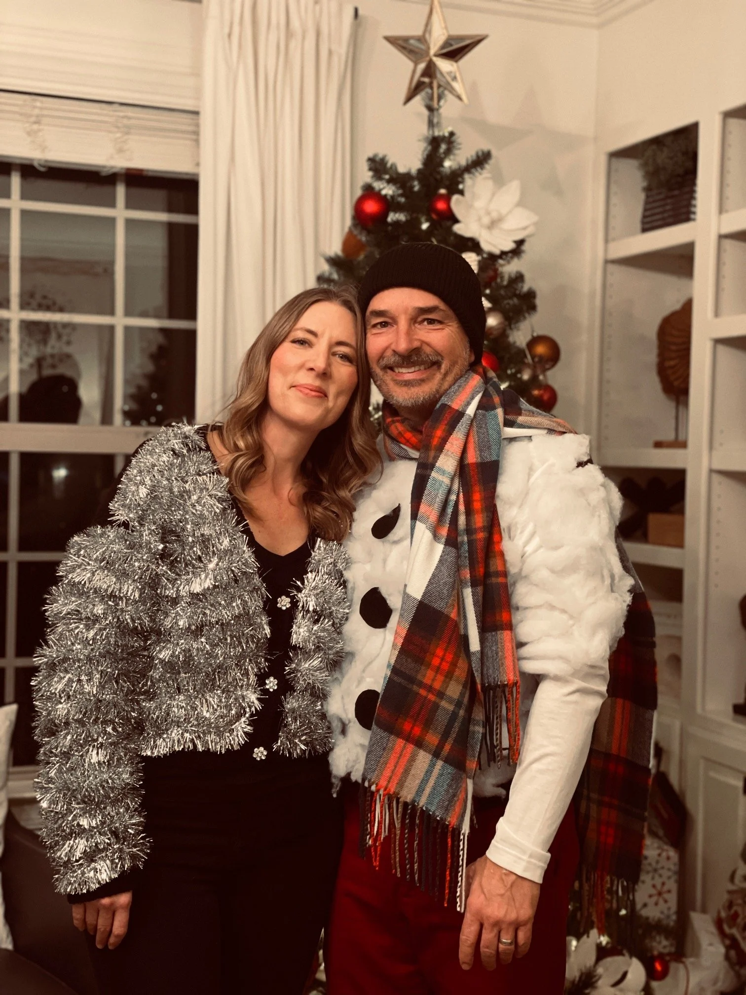 D and K Christmas portrait 2025 silly sweaters.jpg