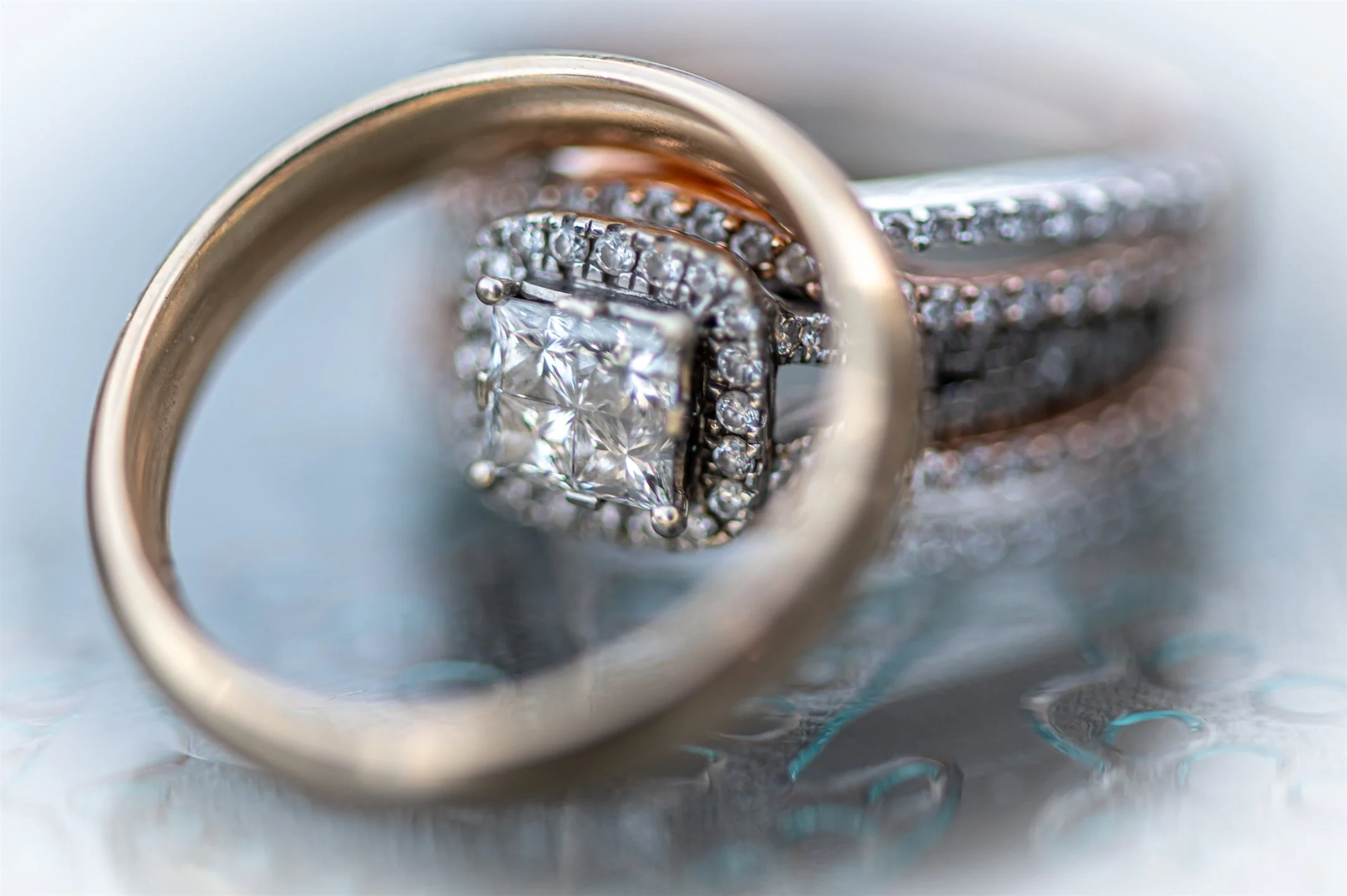 Close-up of diamond engagement ring and wedding band