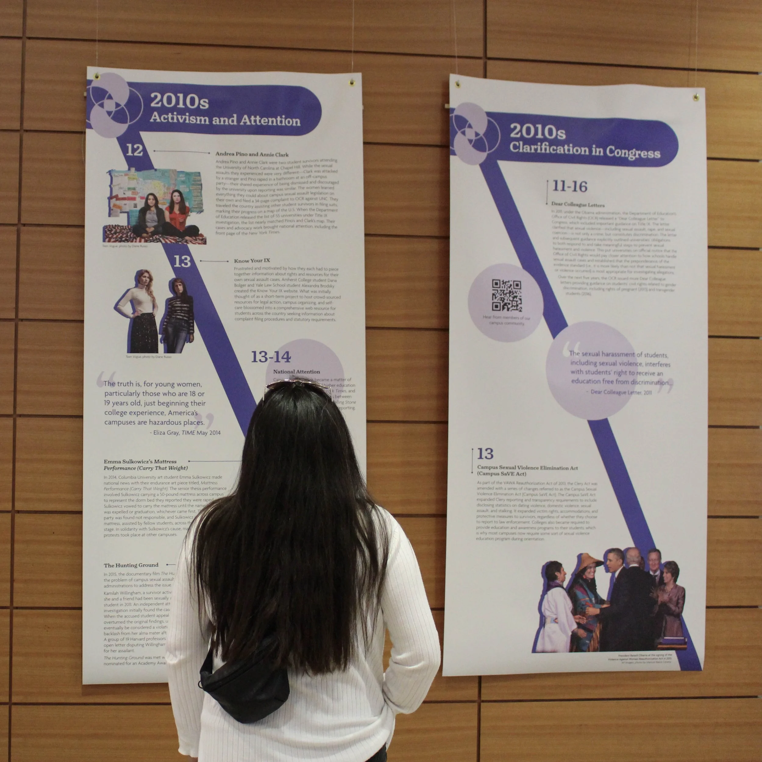 Person viewing a banner that reads 2020s activism and attention.