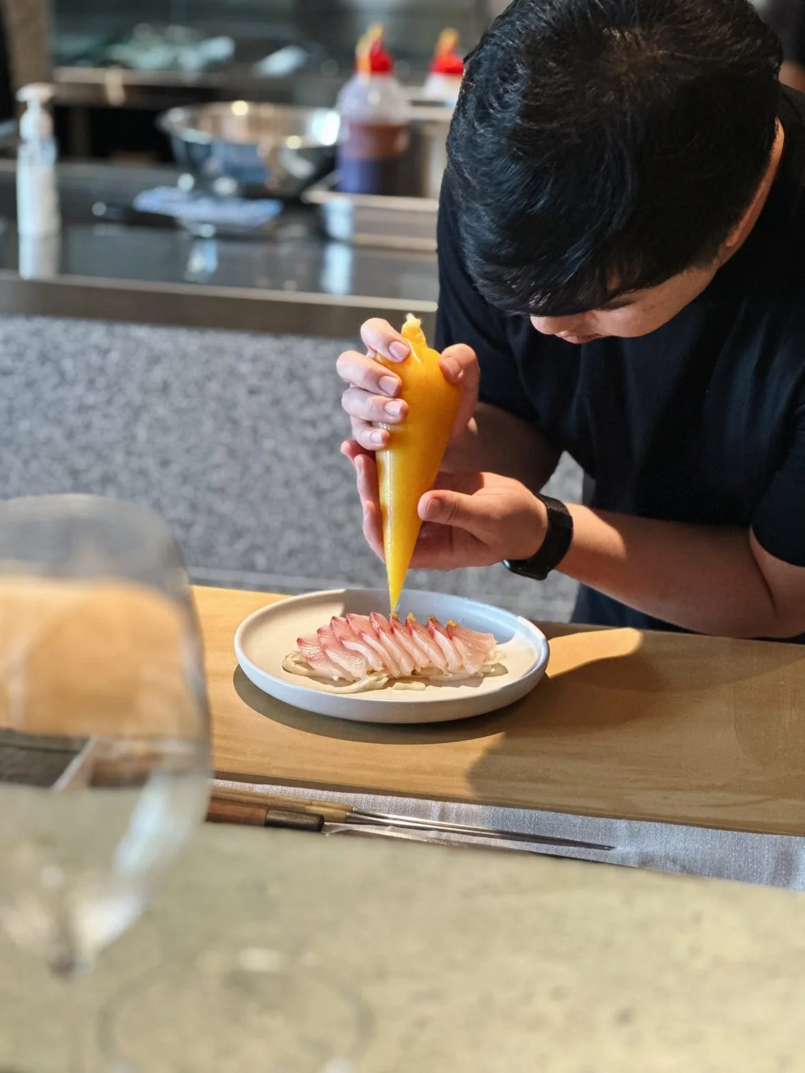Garnishing kingfish sashimi at Nonda