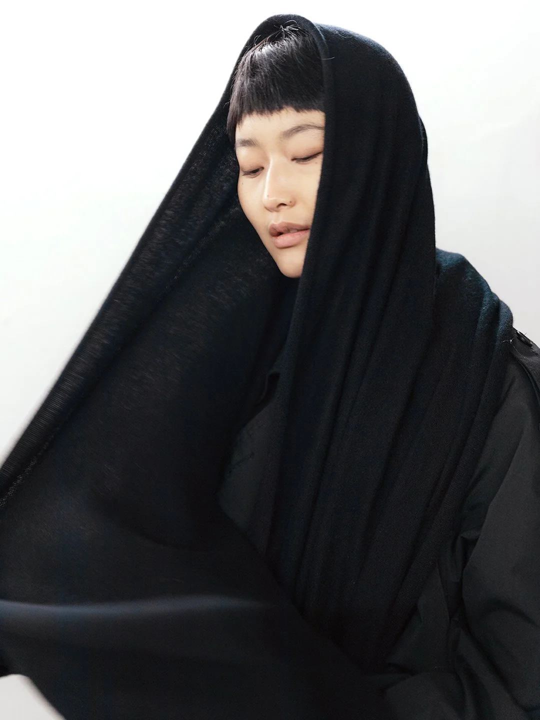 Shop a 100% Mongolian cashmere oversized scarf in black. Ultra-soft, lightweight and warm fine knit. Designed in Berlin and made in Mongolia by Hand of Origin.