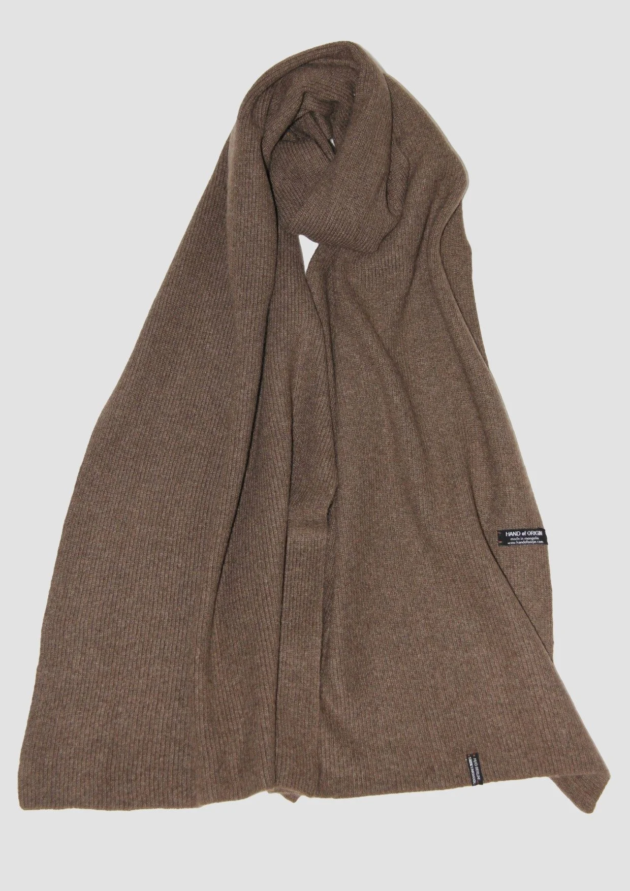 Shop a 100% Mongolian yak wool oversized scarf in natural brown. Warm and lightweight ribbed knit. Designed in Berlin and made in Mongolia by Hand of Origin.