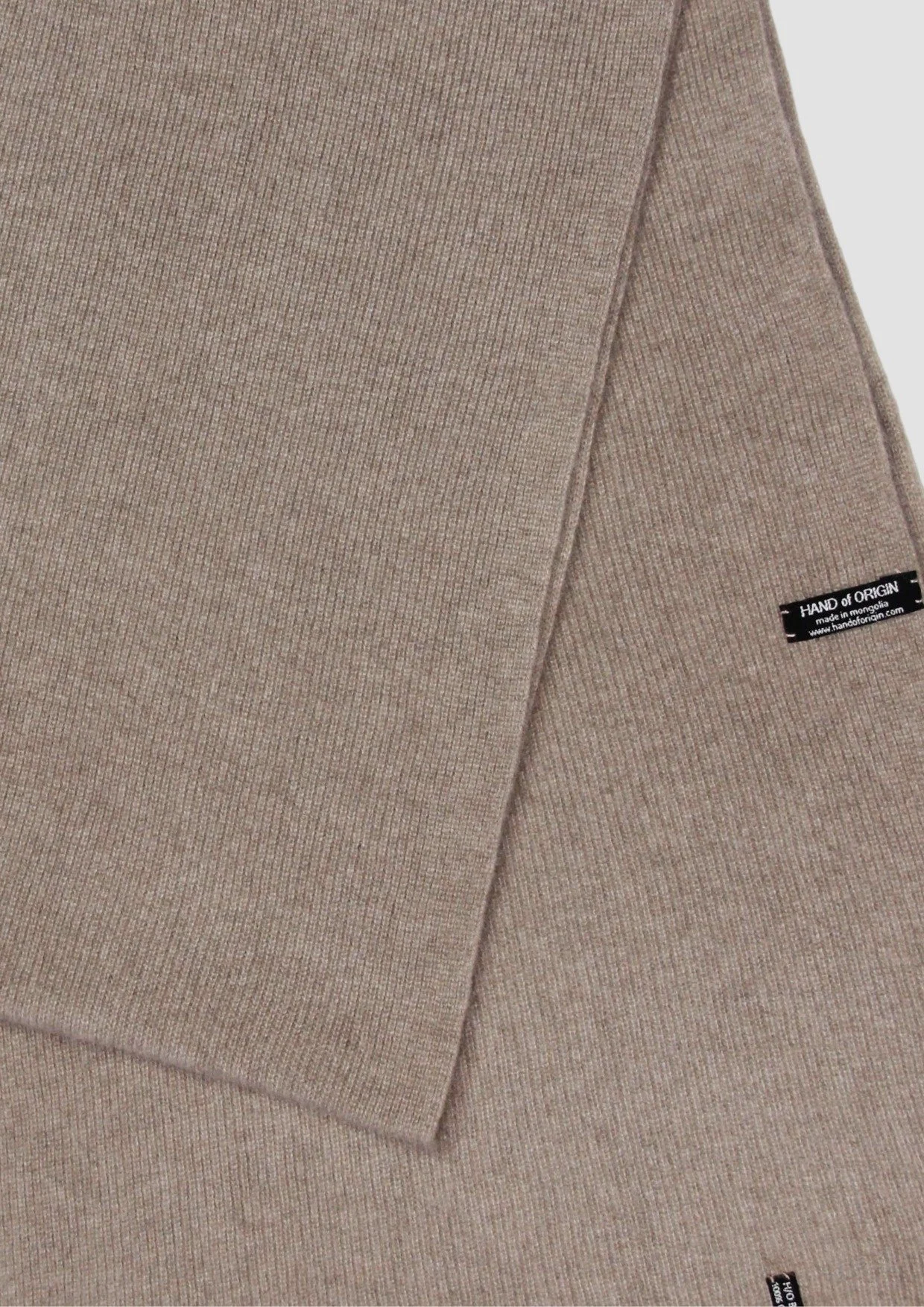 Shop a 100% Mongolian cashmere oversized scarf in natural brown. Ultra-soft, lightweight and warm ribbed knit. Designed in Berlin and made in Mongolia by Hand of Origin
