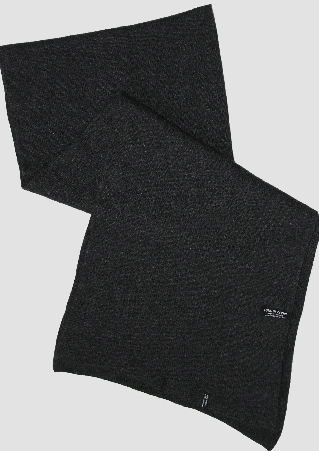 Shop a 100% Mongolian cashmere oversized scarf in anthracite. Ultra-soft, lightweight and warm ribbed knit. Designed in Berlin and made in Mongolia by Hand of Origin.