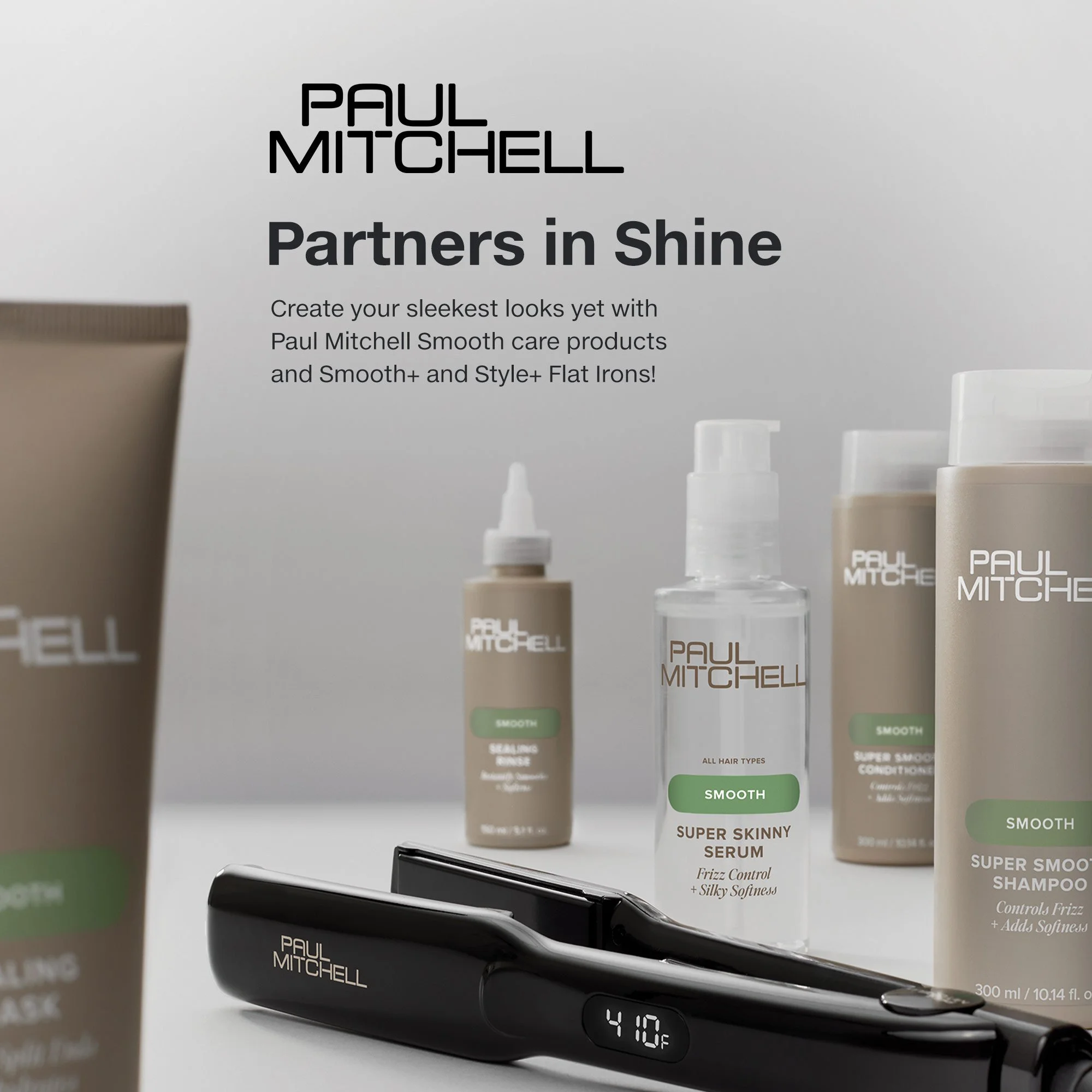 Display of Paul Mitchell hair care products including smoothing serum, shampoo, and conditioner, with a digital iron in the foreground showing 410°F.