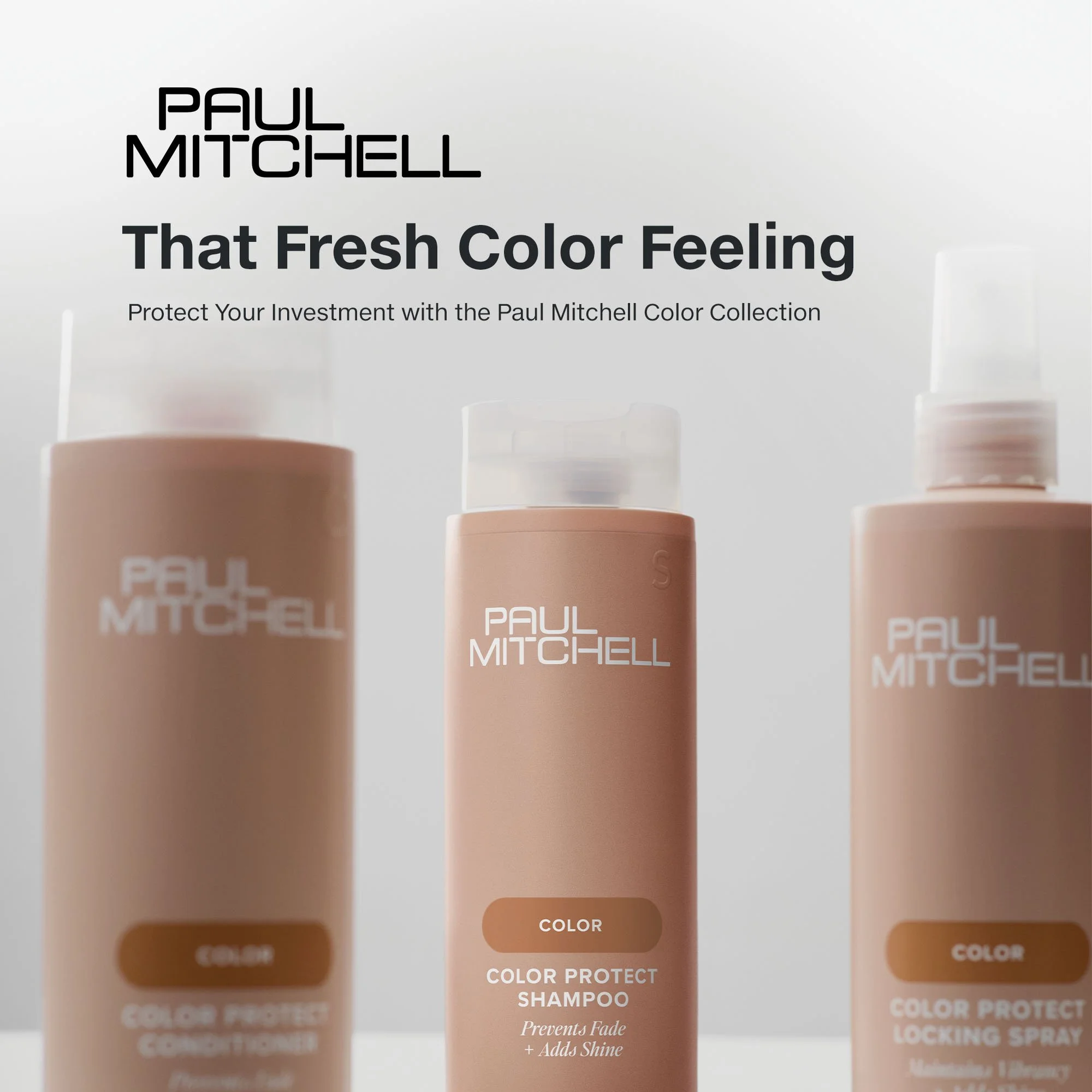 Three bottles of Paul Mitchell hair care products, with the middle bottle in focus, labeled 'Color Protect Shampoo,' flanked by two other bottles of similar design.