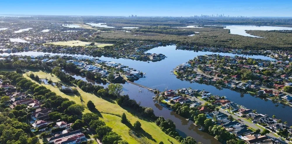 A stunning aerial view of Hope Island's waterways and scenic landscape, highlighting the peaceful residential areas perfect for Hope Island Real Estate opportunities.