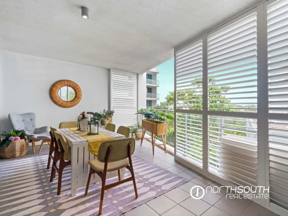 Large balcony with new shutters overlooking greenery at 301 41 Harbour Town Drive Biggera Waters