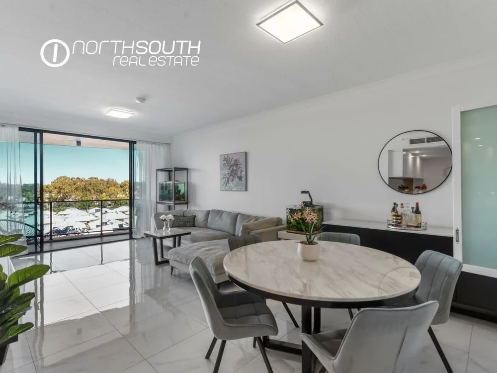 Living and dining zone flowing out to the balcony at apartment 3409, Waterpoint Residences