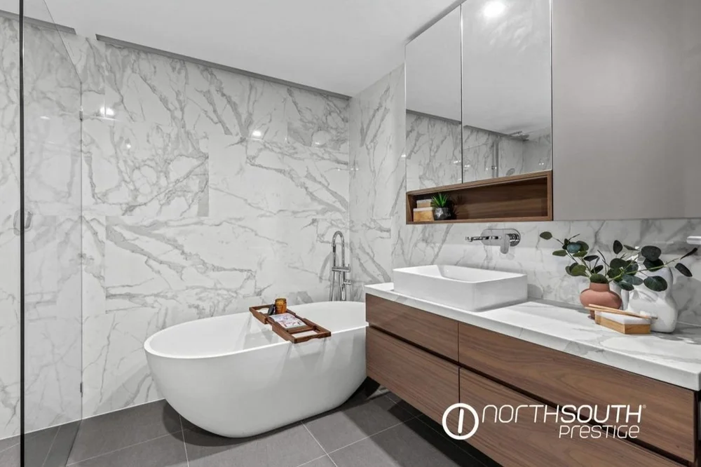 Luxurious bathroom with a beautiful freestanding bath in a high-end Riparian apartment, one of our properties off market on Eagle Street, Brisbane.