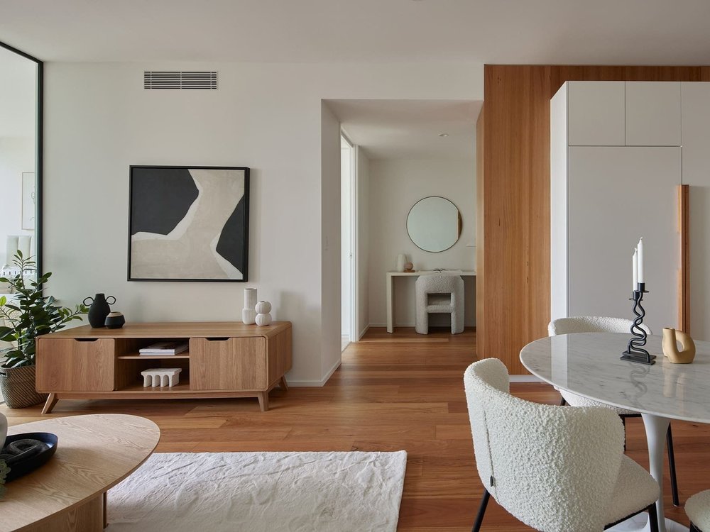 Lounge, dining area, and office nook in luxury Brisbane apartment at 443 Queen St featured in properties for sale
