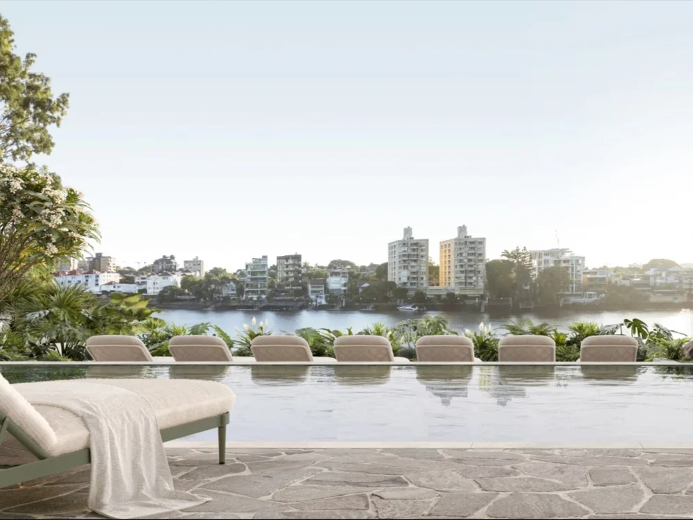 Poolside relaxing chairs at Kangaroo Point Brisbane luxury waterfront apartment featured in properties for sale