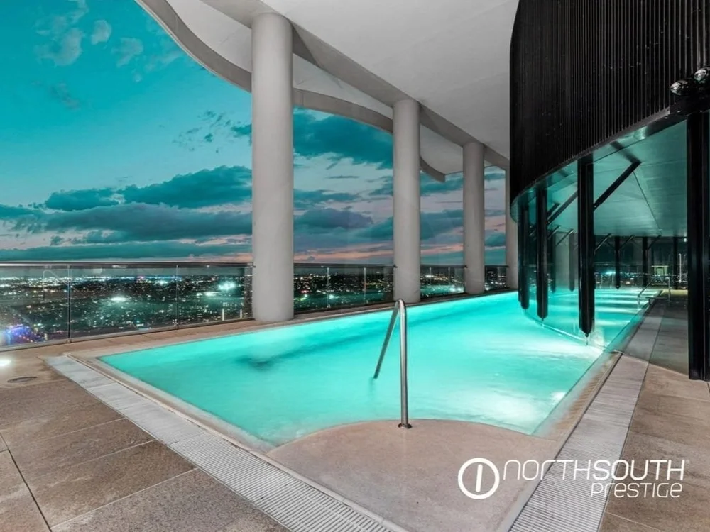 Riparian Plaza luxury Brisbane apartment pool illuminated at night in properties for sale