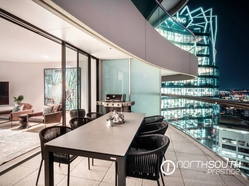 Balcony with city view from Riparian Plaza luxury Brisbane apartment listed in properties for sale