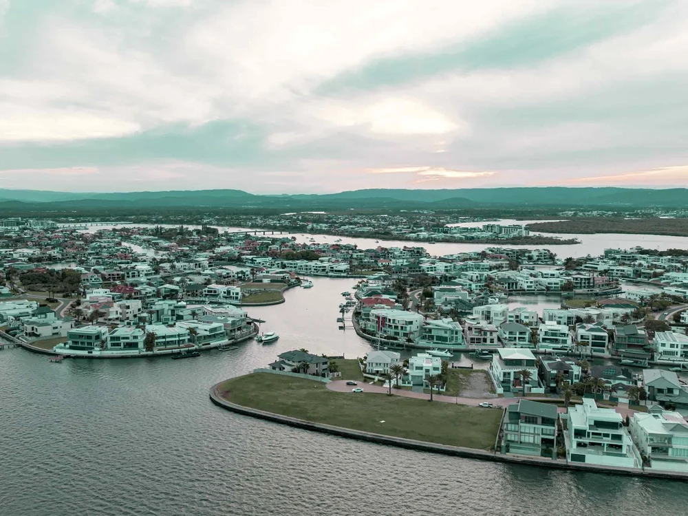 Luxury aerial drone view highlighting Sovereign Islands Gold Coast waterfront properties for sale
