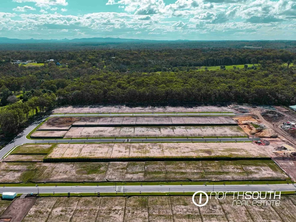 Drone aerial view of Chambers Flat designer homes with surrounding scenic landscape featured in house and land properties for sale