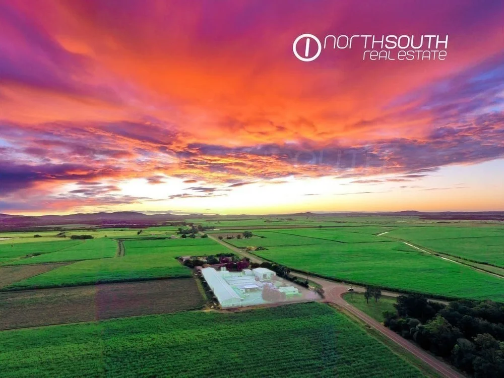 Red sky over the egg farm and three houses on Pimpama Jacobs Well Rd, Norwell