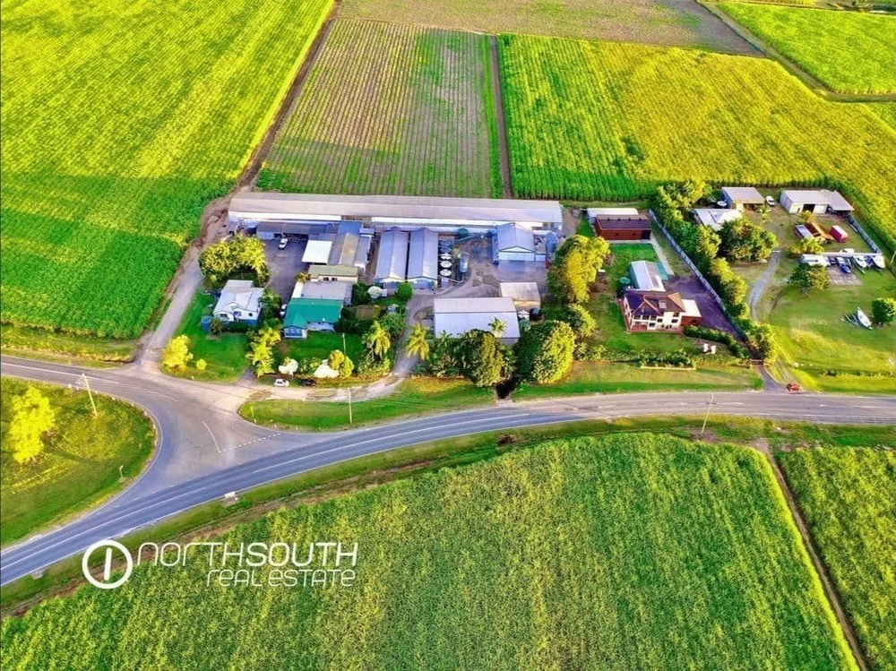 Aerial drone media showing egg farm and 3 houses on Pimpama Jacobs Well Rd Norwell listed in properties for sale