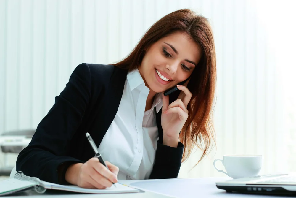 Queensland real estate agent on the phone advising a client about 2025 seller disclosure requirements