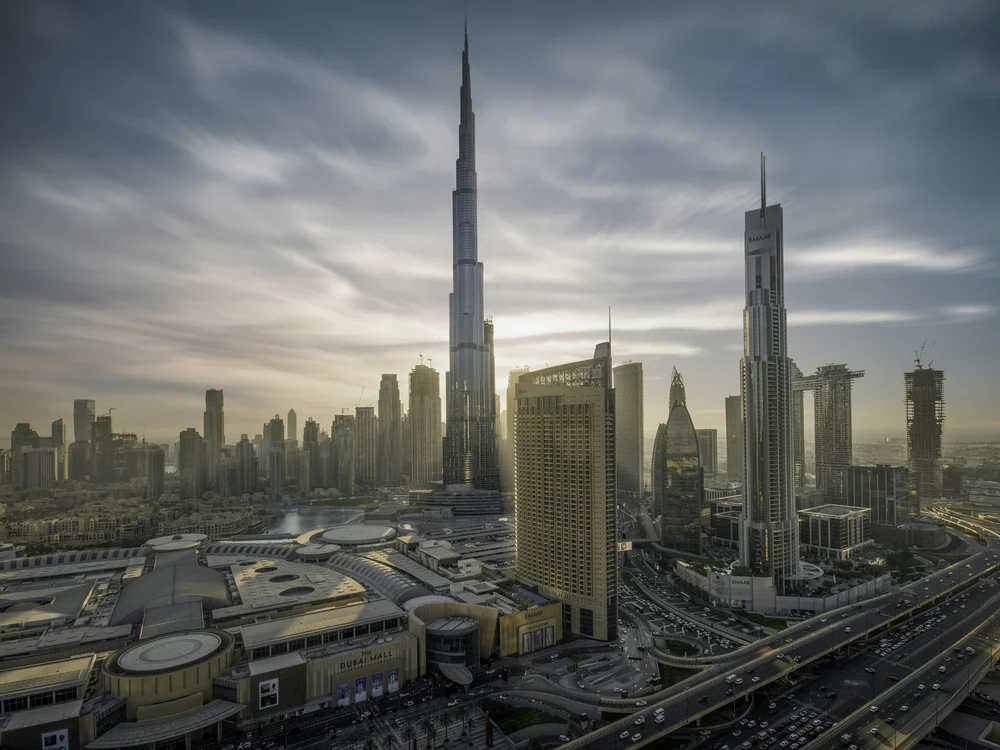 City skyline view from a high-rise apartment, international real estate investment opportunities