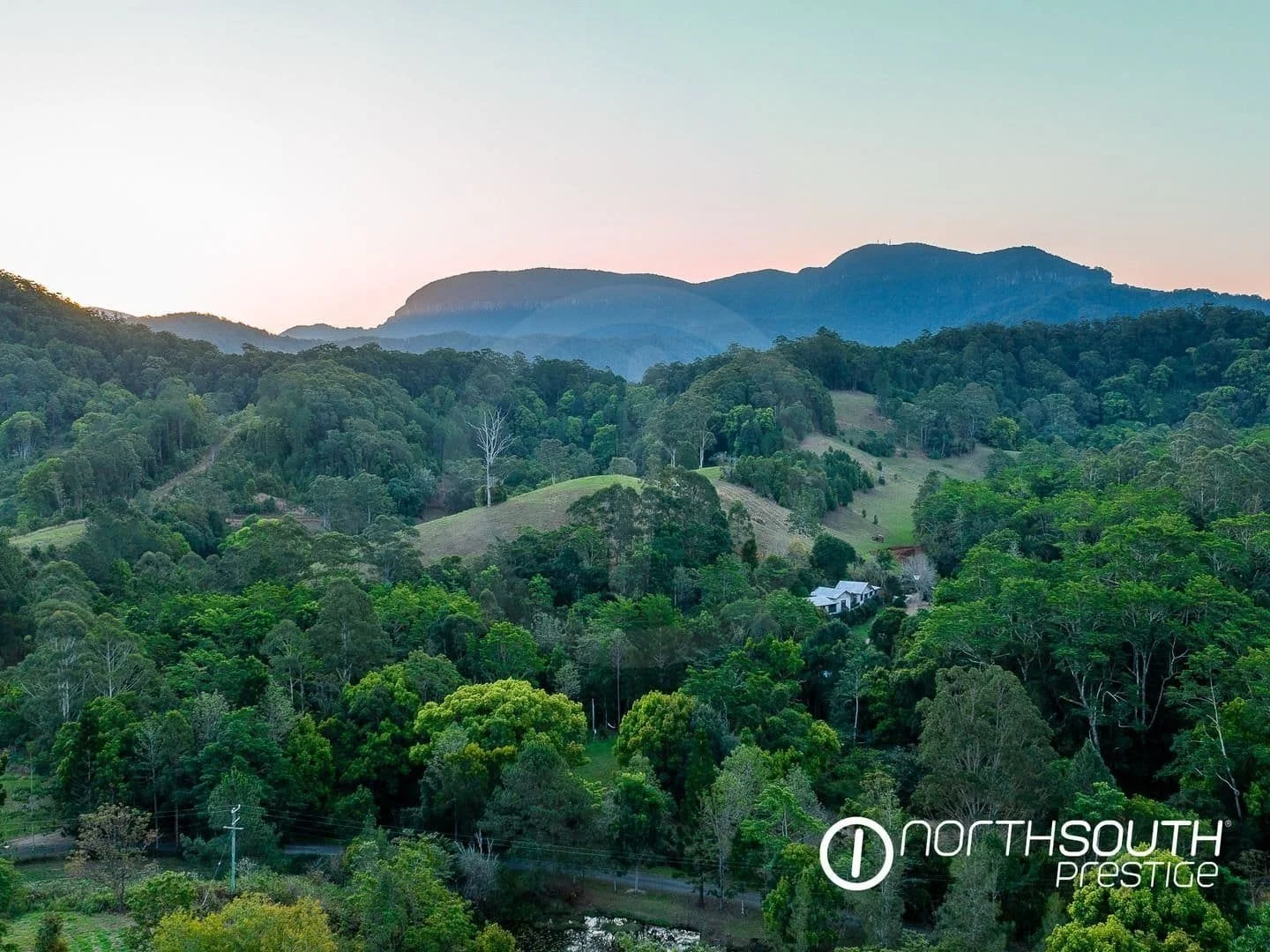Rolling hills at properties for sale northern nsw nobbys creek 100 acres, offering stunning rural views.