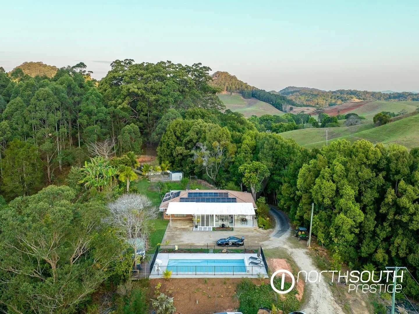 Aerial drone footage of the front of the house at properties for sale northern nsw nobbys creek 100 acres.