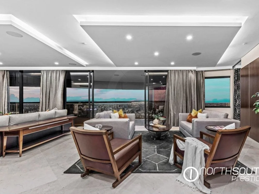 Lounge with city view at properties for sale Brisbane riparian plaza apartment 4202.