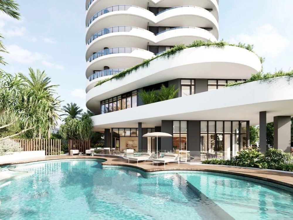 Gold Coast apartment for sale in resort style building with curved architecture and tropical pool deck
