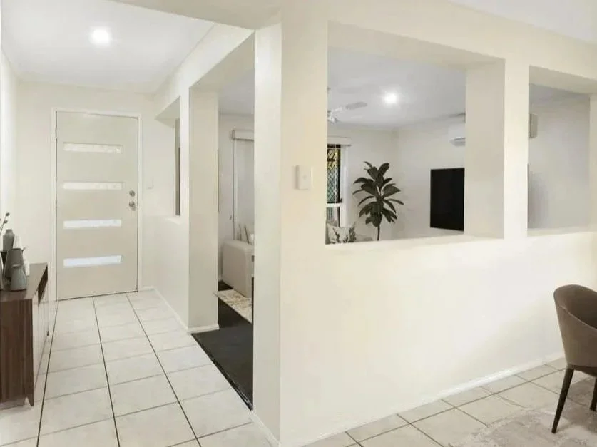 Internal hallway connecting living zones inside Griffin family home showcasing efficient layout 
