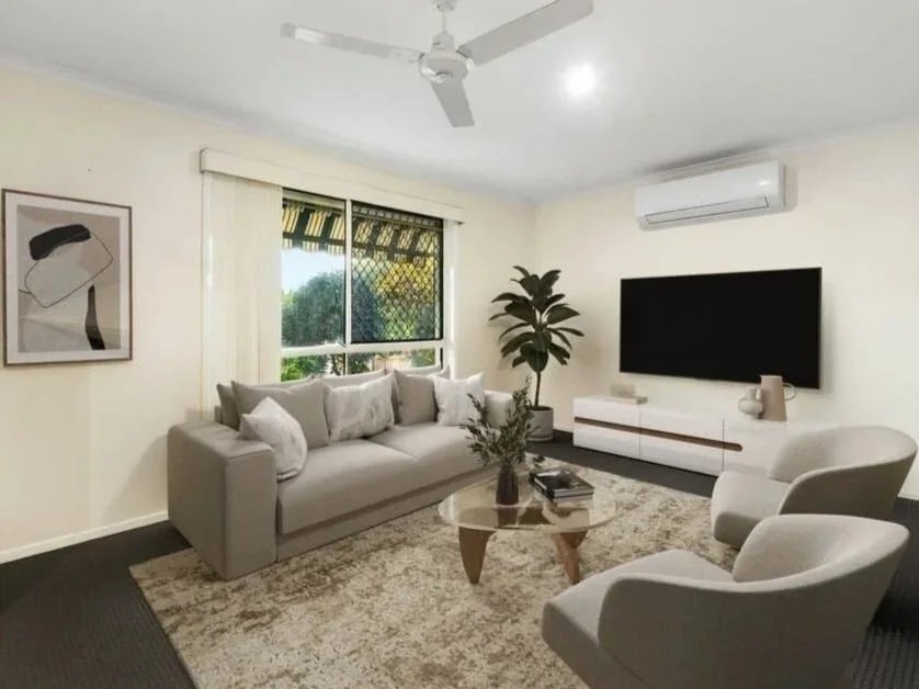 Comfortable living room with sofa seating, wall mounted TV, ceiling fan and natural light at 13 Turquoise Crescent Griffin.