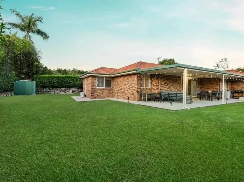 Spacious landscaped backyard at 13 Turquoise Crescent Griffin with level lawn, privacy hedging and garden shed secured through buyer advocacy.