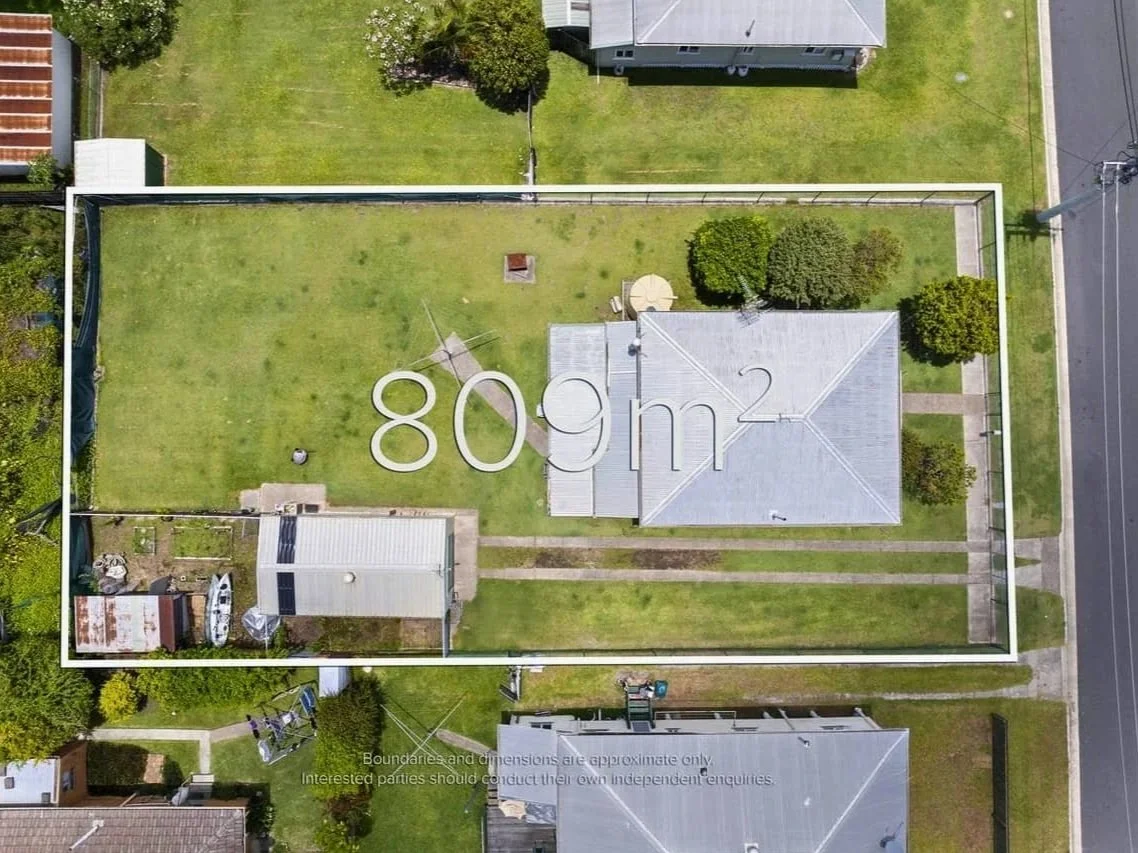Top-down aerial image of an 809 square metre residential block in Beenleigh with boundaries marked, showing a future development site.