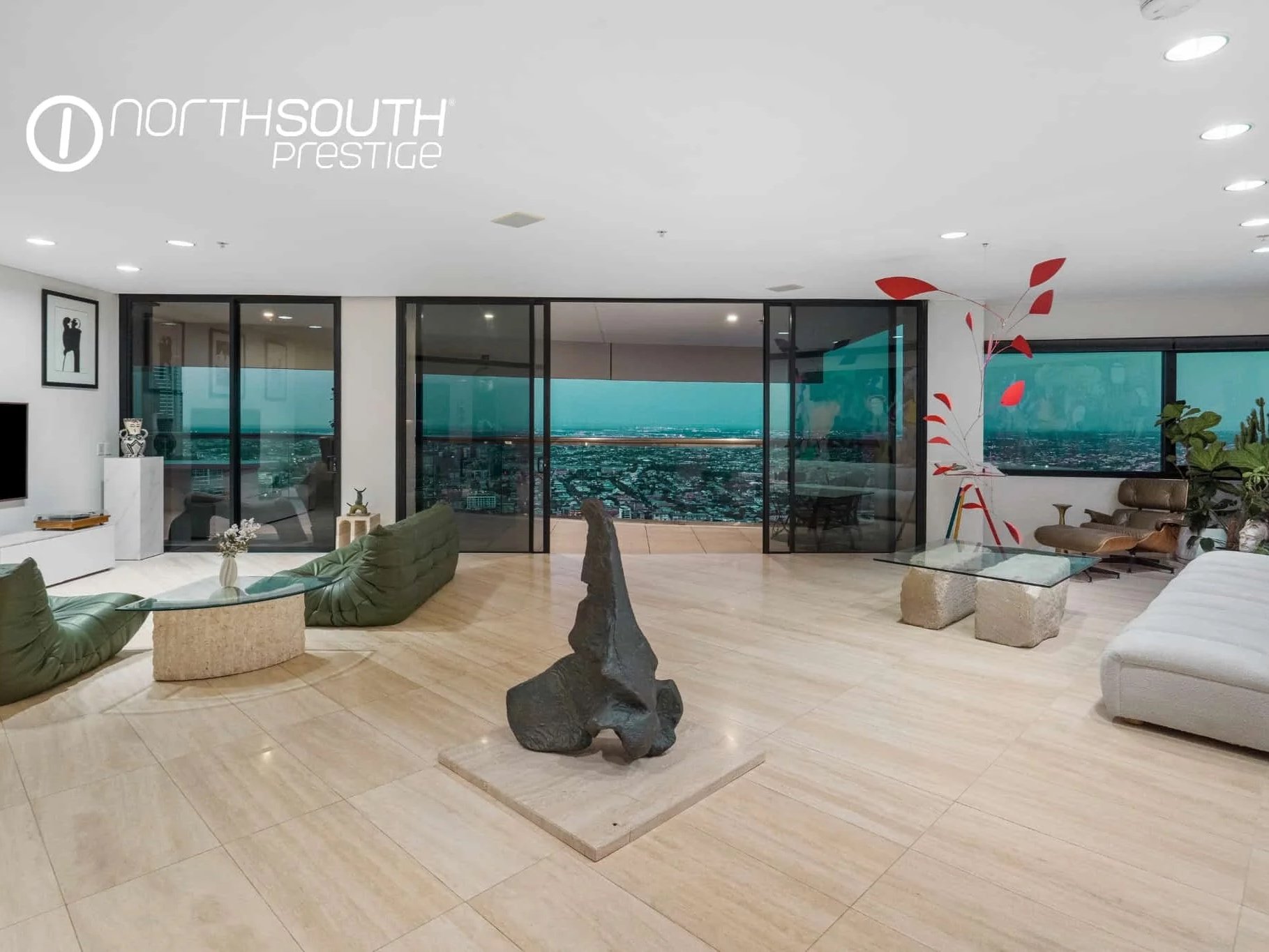 Living and Dining area with city views from balcony on twilight – Brisbane properties for sale Riparian Plaza apartment 5002 