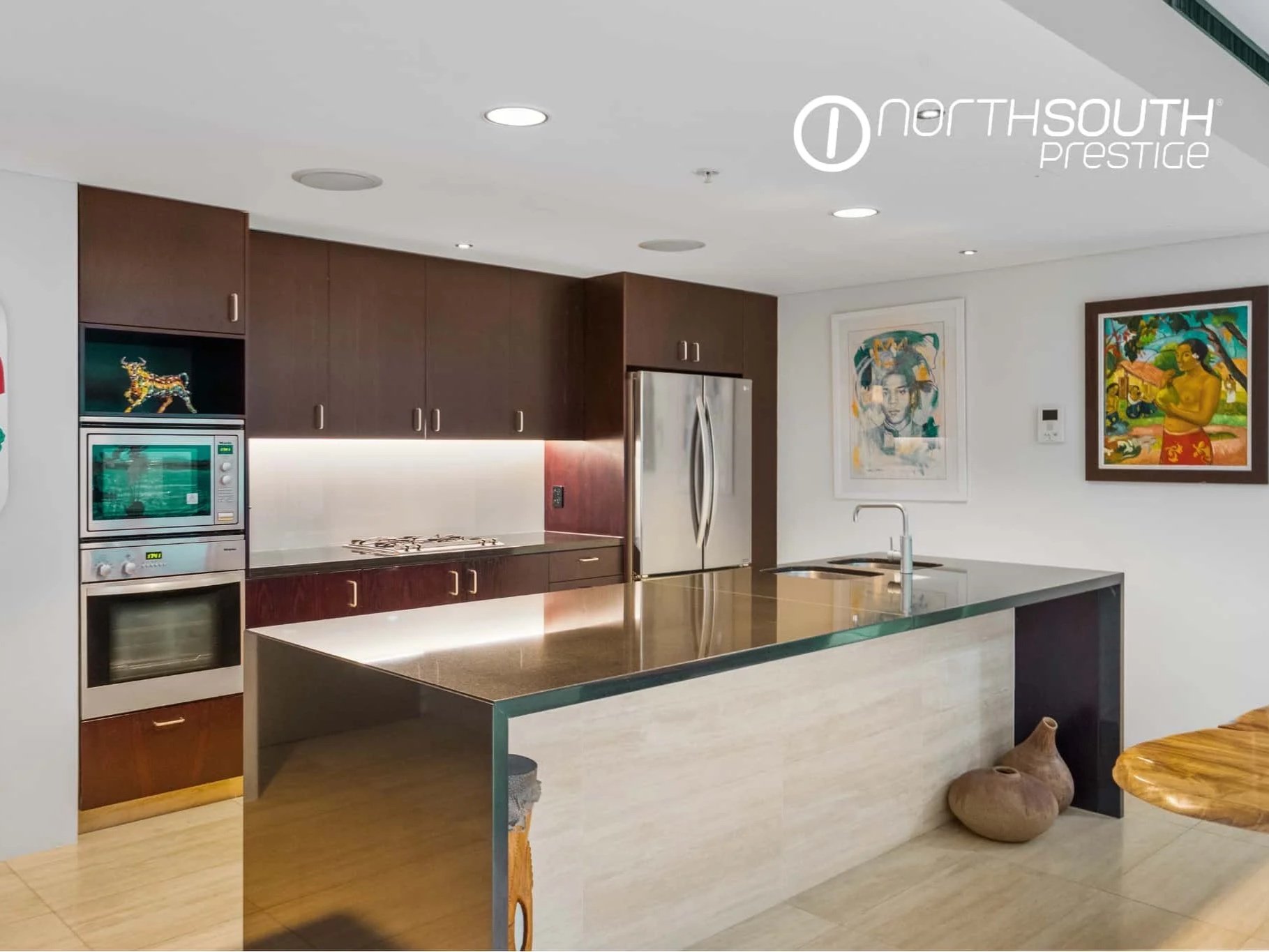 Fully equipped kitchen with granite benchtop and artwork – Brisbane properties for sale Riparian Plaza apartment 5002 