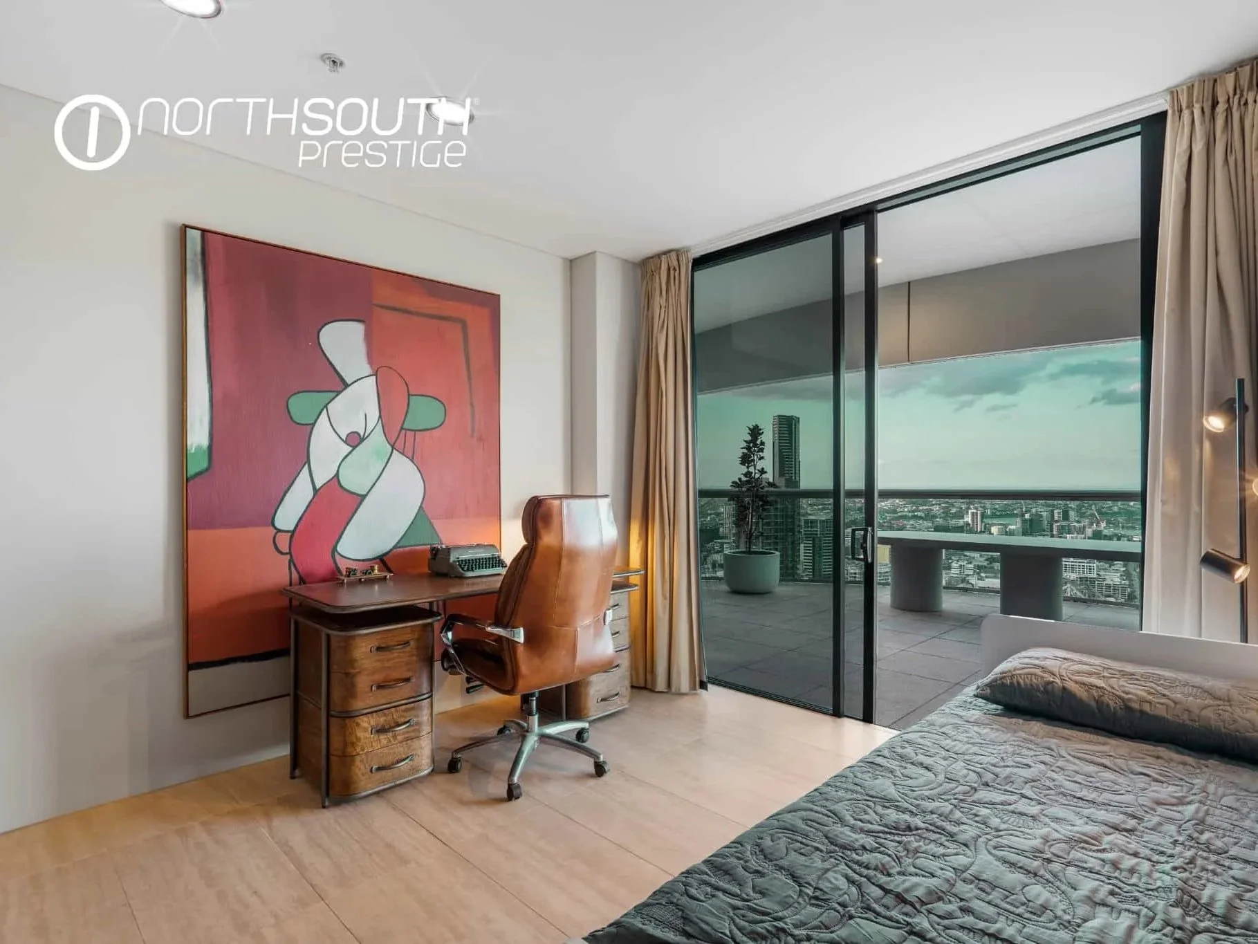 Bedroom with an office and city skyline views – Brisbane properties for sale Riparian Plaza apartment 5002 